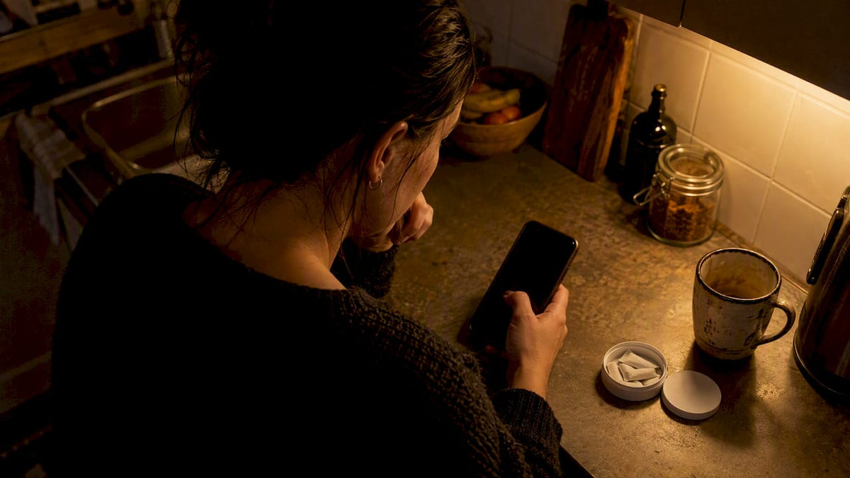Woman pausing before an online nicotine purchase