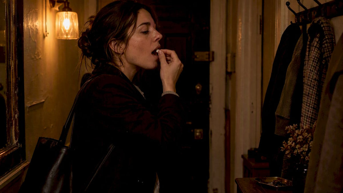 Woman discreetly using sublingual nicotine gel